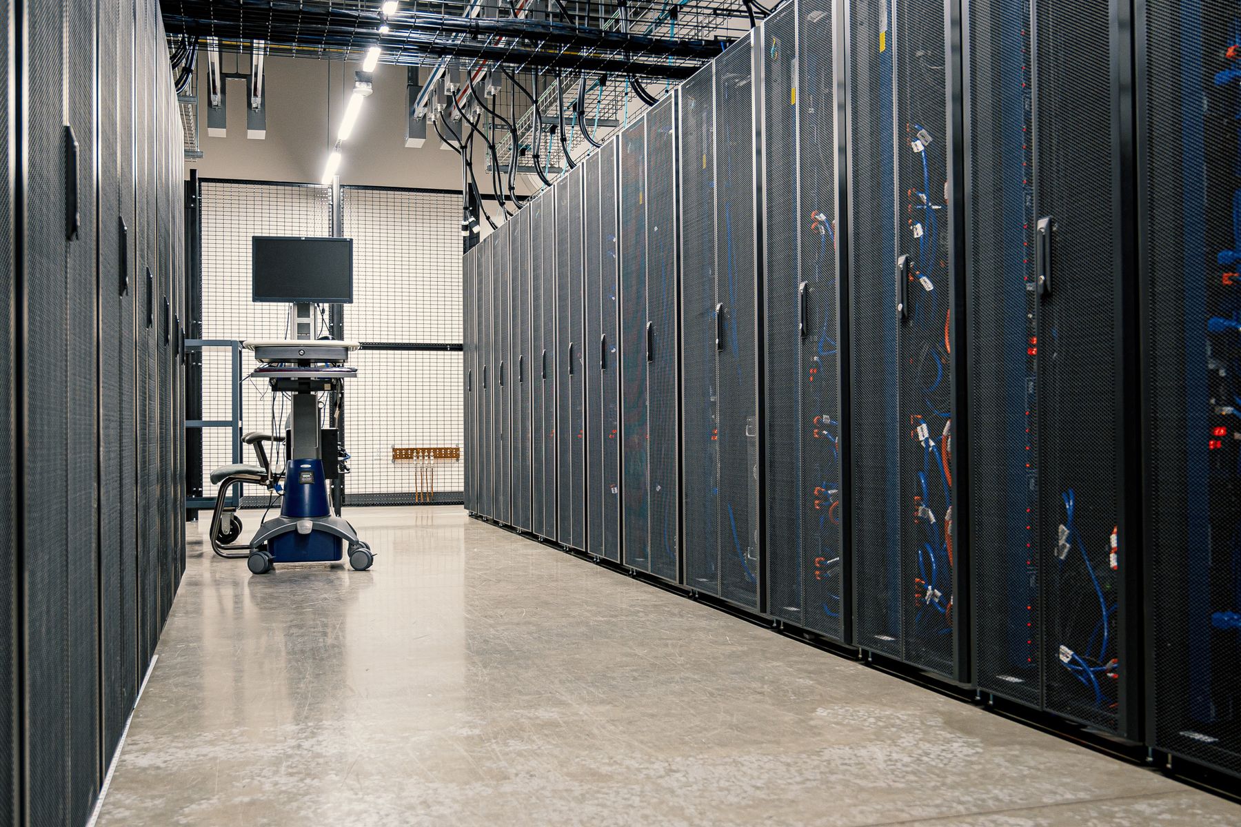 A data centre corridor lined with server racks